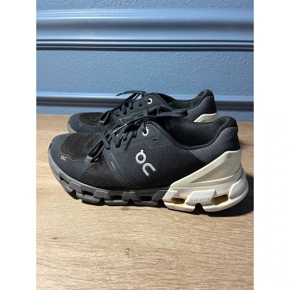 On Cloudnovel Women's Black and Cream Athletic Shoes